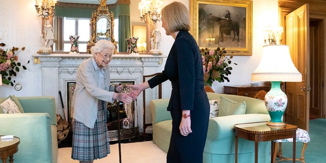 Queen Elizabeth II greets newly elected leader of the Conservative Party Liz Truss as she arrives at Balmoral Castle for an audience where she was to be invited to become prime minister and form a new government on Sept. 6, 2022, in Aberdeen, Scotland. The queen died on Sept. 8, 2022.