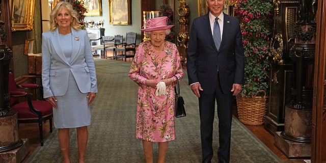Britain's Queen Elizabeth II stands with President Joe Biden and first lady Jill Biden at Windsor Castle on June 13, 2021. (Steve Parsons/Pool via Reuters)
