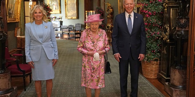 Britain's Queen Elizabeth stands with President Biden and first lady Jill Biden in the Grand Corridor during their visit at Windsor Castle, in Windsor, Britain, on June 13, 2021. (Steve Parsons/Pool via REUTERS)