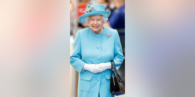 Queen Elizabeth II visits the British Airways headquarters to mark their centenary year at Heathrow Airport on May 23, 2019, in London, England.