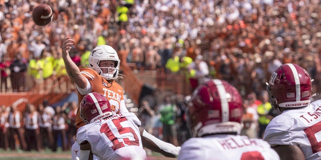 Texas quarterback Quinn Ewers, #3, throws the ball away as Alabama linebacker Dallas Turner, #15, rushes the passer during the first half of an NCAA college football game, Saturday, Sept. 10, 2022, in Austin, Texas. 