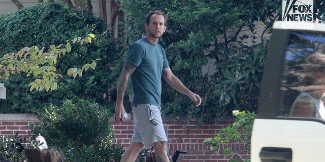 Richie Fletcher walks out of his Memphis home on Saturday afternoon, a day after reporting his wife missing from her routine morning jog.