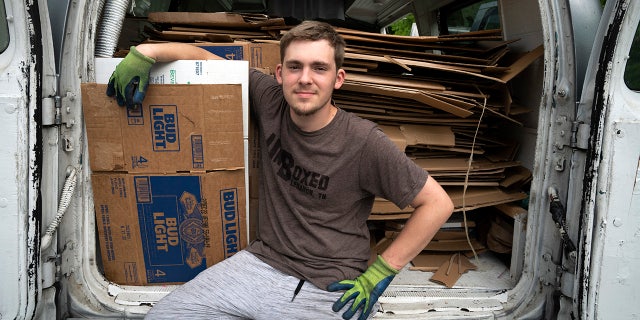 Ashton Gilbert of Tennessee sits in the back of the UnBoxed van.