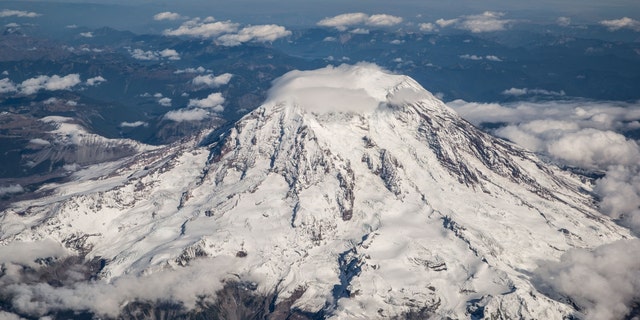 A view of Mount Rainier is photographed from an Alaska Airlines flight flying at 25,000 feet on Sept. 21, 2021, near Seattle, Washington. 