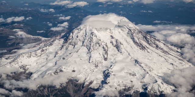A view of Mount Rainier is photographed from an Alaska Airlines flight flying at 25,000 feet on Sept. 21, 2021, near Seattle, Washington.