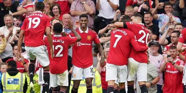 Manchester United celebrate after scoring the second goal against Arsenal in Manchester, England, Sunday 4 September 2022.