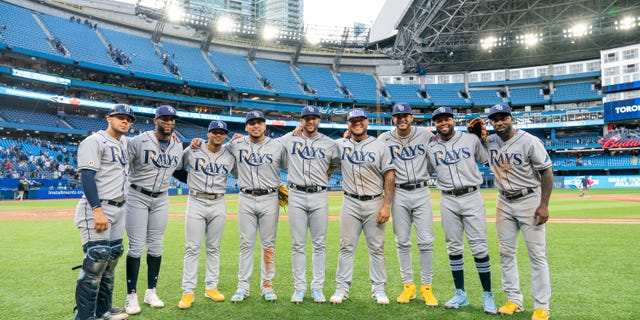 Rene Pinto, Yandy Diaz, Wander Franco, Isaac Paredes, David Peralta, Harold Ramirez, Jose Siri, Manuel Margot and Randy Arozarena of the Tampa Bay Rays pose after playing in the first all-Latino lineup in MLB history. The Rays defeated the Toronto Blue Jays on Roberto Clemente day at the Rogers Centre Sept. 15, 2022, in Toronto, Ontario, Canada.