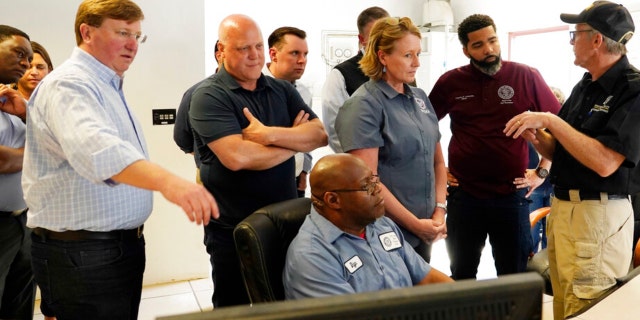 Jim Craig, with the Mississippi State Department of Health, right, explains the purpose of some of the monitors to Jackson Mayor Chokwe Antar Lumumba, second from right, Deanne Criswell, administrator of the Federal Emergency Management Agency, center, White House Infrastructure Coordinator Mitch Landrieu, second from left, and Mississippi Gov. Tate Reeves, left, during a visit to the City of Jackson's O.B. Curtis Water Treatment Facility in Ridgeland, Miss., Friday, Sept. 2, 2022. 