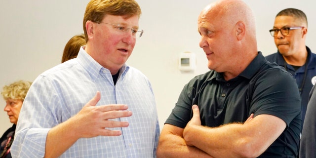 White House Infrastructure Coordinator Mitch Landrieu, right, and Mississippi Gov. Tate Reeves, left, confer during a visit by Deanne Criswell, administrator of the Federal Emergency Management Agency (FEMA), to the City of Jackson's O.B. Curtis Water Treatment Facility in Ridgeland, Miss., Friday, Sept. 2, 2022.