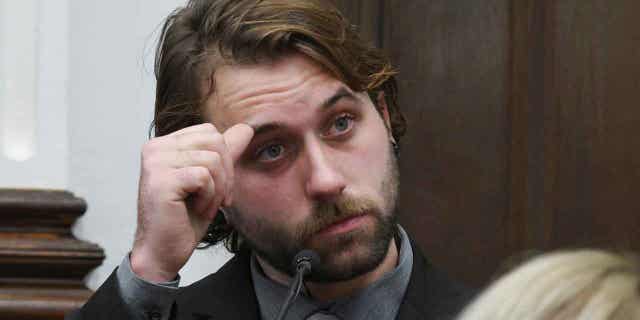 Gaige Grosskreutz watches video of the shooting as he testifies about being shot in the right bicep during Kyle Rittenhouse's trial at the Kenosha County Courthouse in Kenosha, Wis., on Nov. 8, 2021.