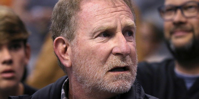 FILE - Phoenix Suns owner Robert Sarver watches the team play against the Memphis Grizzlies during the second half of an NBA basketball game in Phoenix, Dec. 11, 2019. 