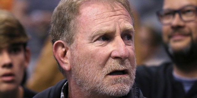 FILE - Phoenix Suns owner Robert Sarver watches the team play against the Memphis Grizzlies during the second half of an NBA basketball game in Phoenix, Dec. 11, 2019.