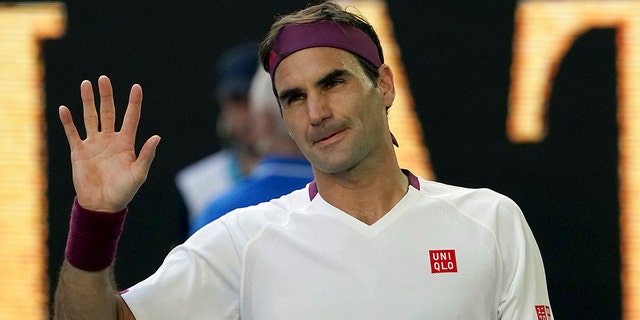 In this Jan. 28, 2020, file photo, Roger Federer of Switzerland waves after defeating Tenis Sandgren of the United States during their quarterfinal match at the Australian Open in Melbourne.