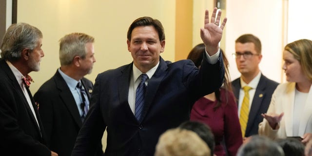 Florida Gov. Ron DeSantis waves as he arrives for a press conference to announce expanded toll relief for Florida commuters, Wednesday, Sept. 7, 2022, in Miami. 