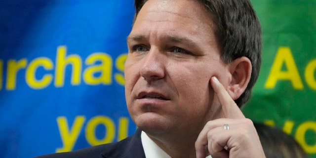 FILE - Florida Governor Ron DeSantis listens to a question during a news conference September 7, 2022 in Miami, Florida.