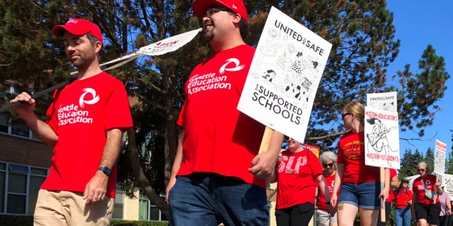 Teachers and staff from Jane Addams Middle School in north Seattle picket on what was supposed to be the first day of classes Wednesday, Sept. 7, 2022.