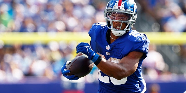 Saquon Barkley of the New York Giants in action against the Carolina Panthers during a game at MetLife Stadium on September 18, 2022 in East Rutherford, NJ