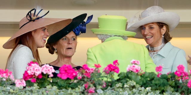 Queen Elizabeth II speaks with Sarah Ferguson and others at a polo match in 2018.