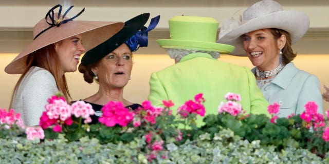 Queen Elizabeth II speaks with Sarah Ferguson and others at a polo match in 2018.