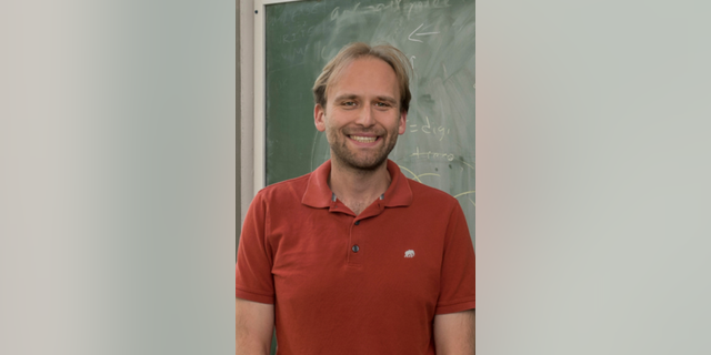 Northern Illinois University physics professor Jahred Adelman