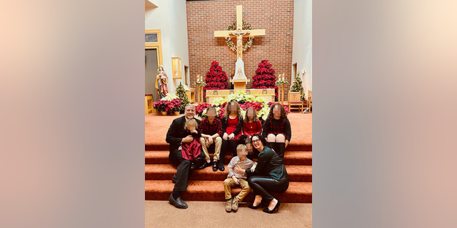 Mark Houck with his family at a Catholic Church. 