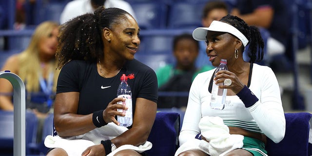 Serena Williams and Venus Williams of the United States look on during a substitution against Lucie Hradecka and Linda Noskova of the Czech Republic during their women's doubles first round match on day four of the 2022 US Open at the USTA Billie Jean King National Tennis Center on March 01, 2022 in The District Flushing in the borough of Queens in New York City.
