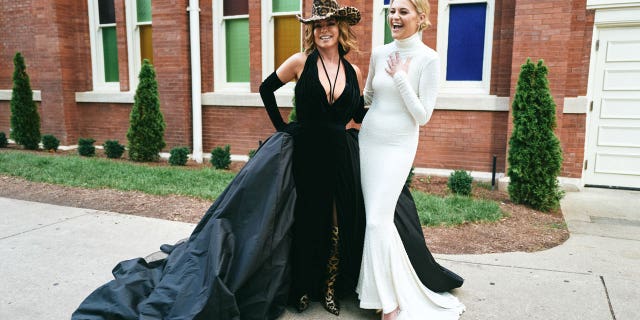 Shania Twain smiles as Kelsea Ballerini wears her famous 1999 Grammys dress to the 2022 ACM Honors.