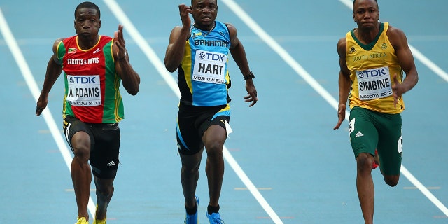 Antoine Adams, of Saint Kitts and Nevis, Shavez Hart, of the Bahamas, and Akani Simbine, of South Africa, compete in the Men's 100-meter heats during Day One of the 14th IAAF World Athletics Championships Moscow 2013 at Luzhniki Stadium on August 10, 2013, in Moscow.