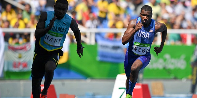 Shavez Hart, of the Bahamas, and Ameer Webb, of the U.S., compete.