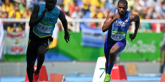 Shavez Hart, of the Bahamas, and Ameer Webb, of the U.S., compete.