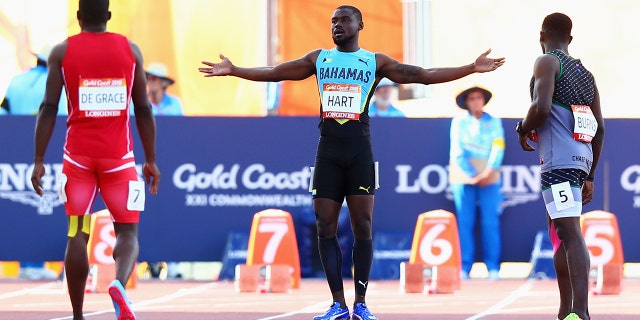 Shavez Hart of the Bahamas (C) reacts after a false start in the Men's 100-meter heat on Day Four of the Gold Coast 2018 Commonwealth Games at Carrara Stadium on April 8, 2018, on the Gold Coast, Australia.