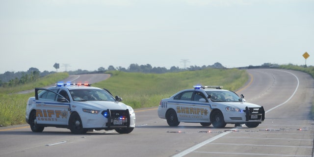 Harris County Sheriff's vehicles block the Crosby Freeway in Crosby, Texas, Aug. 31, 2017. 