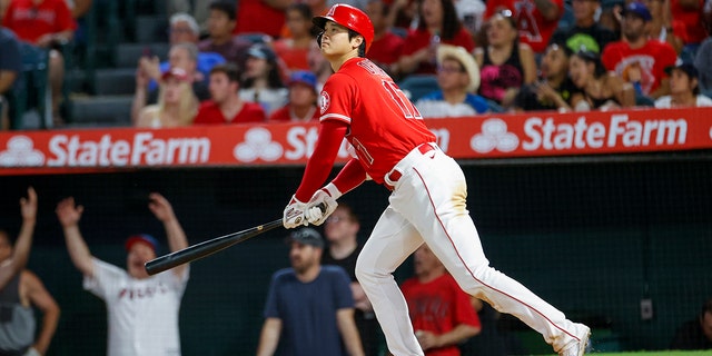 Los Angeles Angels' Shohei Ohtani watches his solo home run during the seventh inning of a baseball game against the Detroit Tigers in Anaheim, California, Monday, Sept. 5, 2022.