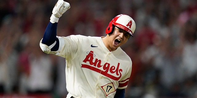 Los Angeles Angels designated hitter Shohei Ohtani, #17, reacts as he runs the bases after hitting a home run during the sixth inning of a baseball game against the New York Yankees in Anaheim, California, Wednesday, Aug. 31, 2022.