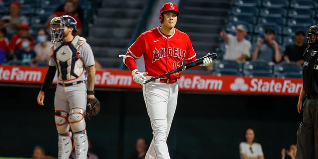 Los Angeles Angels' Shohei Ohtani walks back to the dugout after striking out during the eighth inning of a baseball game against the Detroit Tigers in Anaheim, California, Monday, Sept. 5, 2022.