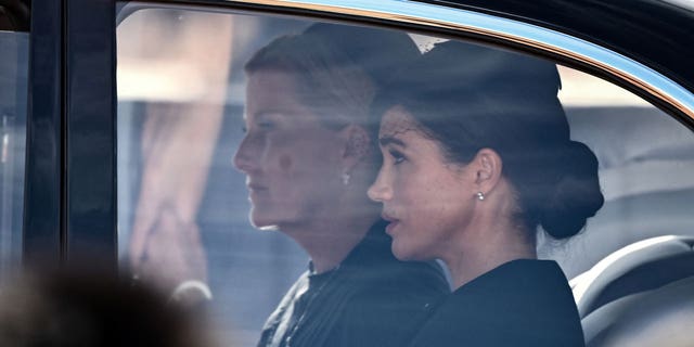 Meghan Markle and Sophie, Countess of Wessex, sit together on their way to Westminster Hall for Queen Elizabeth's funeral.