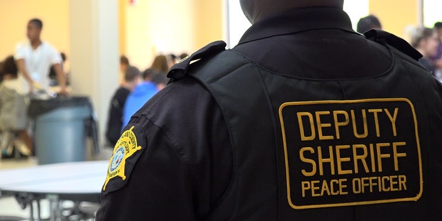 An SRO watches students at lunchtime at a Lexington-Richland District 5 school in South Carolina.