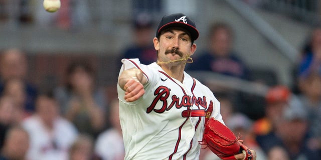 Atlanta Braves starting pitcher Spencer Strider throws to first base in the fourth inning of a baseball game against the Houston Astros Saturday, Aug. 20, 2022, in Atlanta.