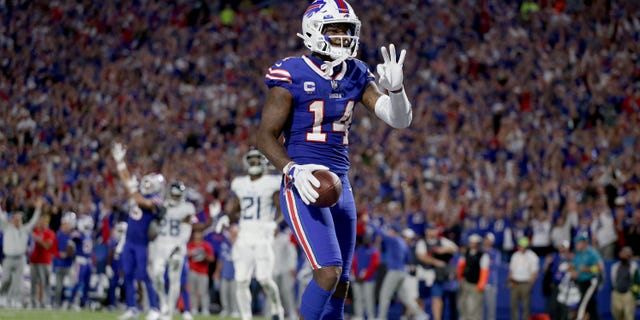 Stefon Diggs #14 of the Buffalo Bills celebrates after scoring his third touchdown of the night against the Tennessee Titans during the third quarter of the game at Highmark Stadium on September 19, 2022 in Orchard Park, New York.