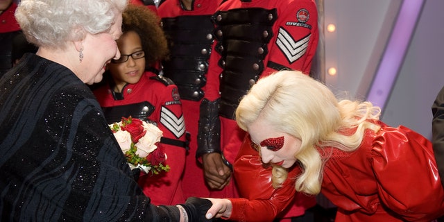 While Miley Cyrus was the host in 2009, Lady Gaga was a performer, and was able to meet the Queen after her performance at the Royal Variety Show.