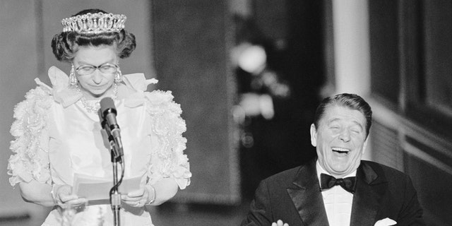President Reagan laughs following a joke by Queen Elizabeth II during a 1982 state dinner held at the De Young Museum in San Francisco.