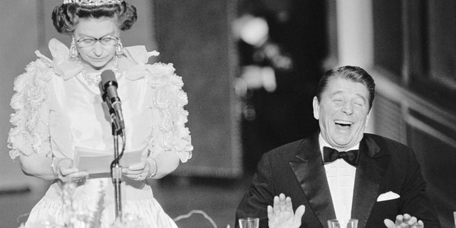 President Reagan laughs following a joke by Queen Elizabeth II during a 1982 state dinner held at the De Young Museum in San Francisco.