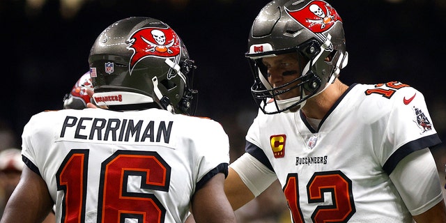 Tom Brady (12) of the Tampa Bay Buccaneers reacts after Breshad Perriman caught a touchdown pass during the fourth quarter against the New Orleans Saints at Caesars Superdome in New Orleans on Sept. 18, 2022.