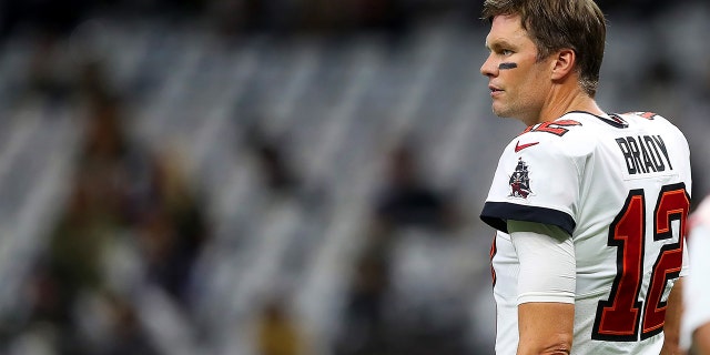 Tampa Bay Buccaneers quarterback Tom Brady (12) removes his helmet and looks toward the sidelines during the Tampa Bay Buccaneers and New Orleans Saints regular season game September 29. February 18, 2022 at Caesars Superdome in New Orleans, LA.
