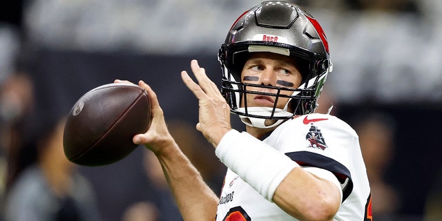 Tampa Bay Buccaneers quarterback Tom Brady warms up before the first half of an NFL football game against New Orleans Saints in New Orleans, Sunday, Sept. 18, 2022.