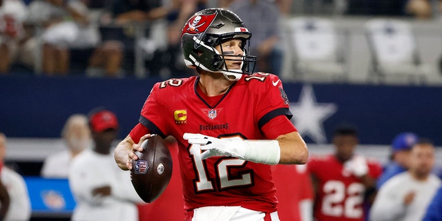 Tampa Bay Buccaneers quarterback Tom Brady prepares to throw a pass during the first half of an NFL football game against the Dallas Cowboys in Arlington, Texas, Sunday, Sept. 11, 2022.