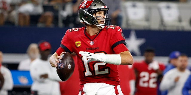 Tampa Bay Buccaneers quarterback Tom Brady prepares to throw a pass in the first half of a NFL football game against the Dallas Cowboys in Arlington, Texas, Sunday, Sept. 11, 2022.