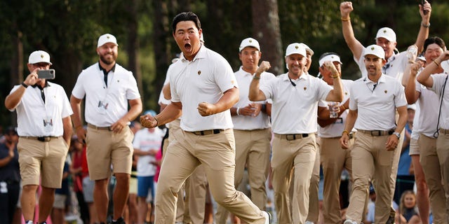 Tom Kim of South Korea and the International Team celebrates his hole-winning putt to win the match 1 Up with teammate Si Woo Kim of South Korea on Sept. 24, 2022 in Charlotte, North Carolina.