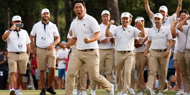 Tom Kim of South Korea and the International Team celebrates his hole-winning putt to win the match 1 Up with teammate Si Woo Kim of South Korea on Sept. 24, 2022 in Charlotte, North Carolina.