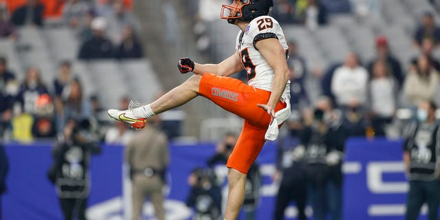 Oklahoma punter Tom Hutton punts during the PlayStation Fiesta Bowl against Notre Dame Fighting Irish on January 1, 2022 at State Farm Stadium in Glendale, Arizona.